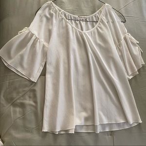 Cute ivory summer top!  Bell sleeves, slit at shoulder!  Looks brand new!